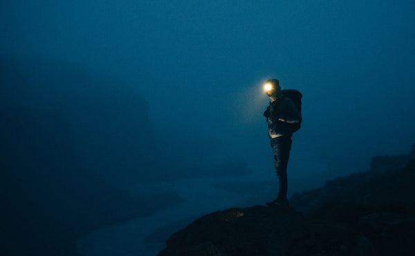 A person night hiking with the Original Shadow Guide 31.